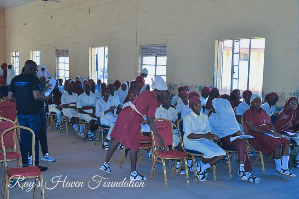 Students receiving self-care kits at the event