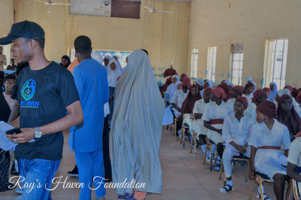 Students receiving self-care kits at the event
